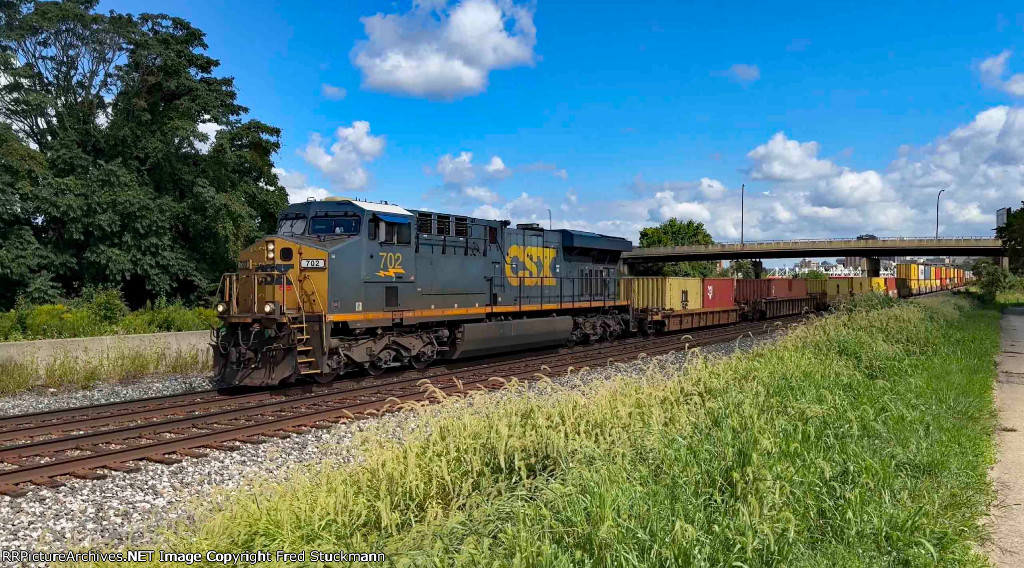 CSX 702 leads another I135.